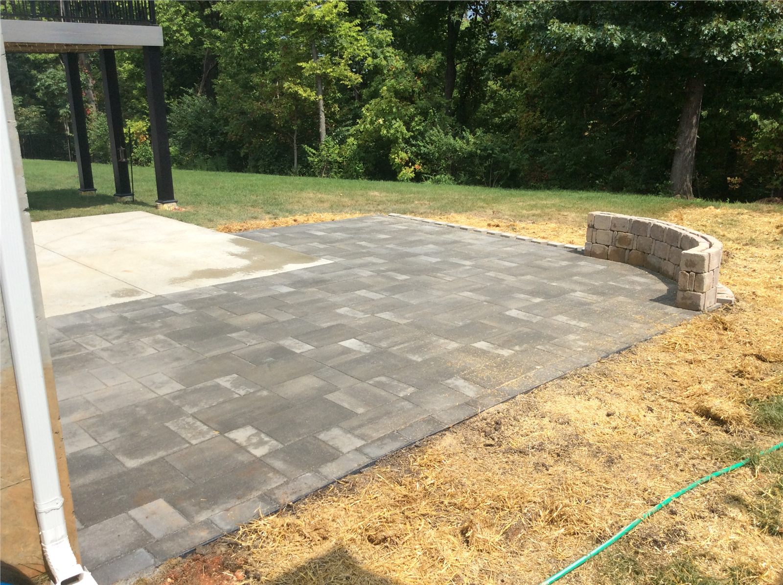Detailed view of a newly installed gray paver patio